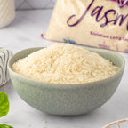 Bowl of rice with a bag of Riceland rice in the background